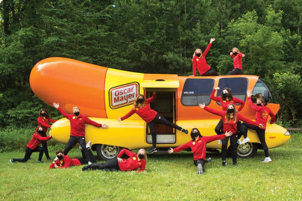 Oscar Mayer Hotdoggers criss-cross the United States in the Wienermobile.
