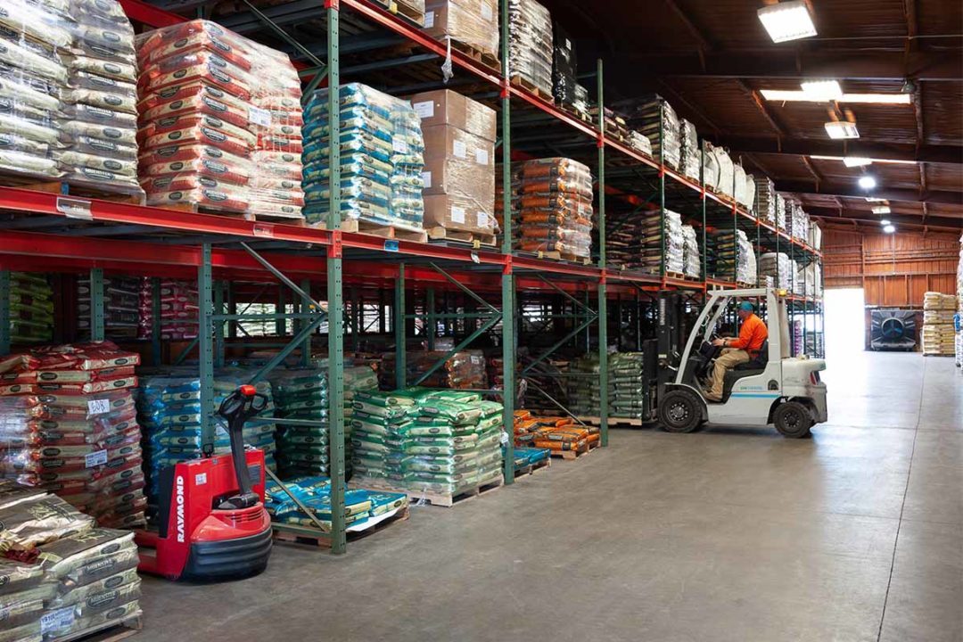 Warehouse with shelves lined with bags of pet food