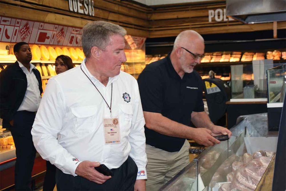 Photo of Dan Halstrom and Randy Spronk of USMEF in a grocery store abroad.