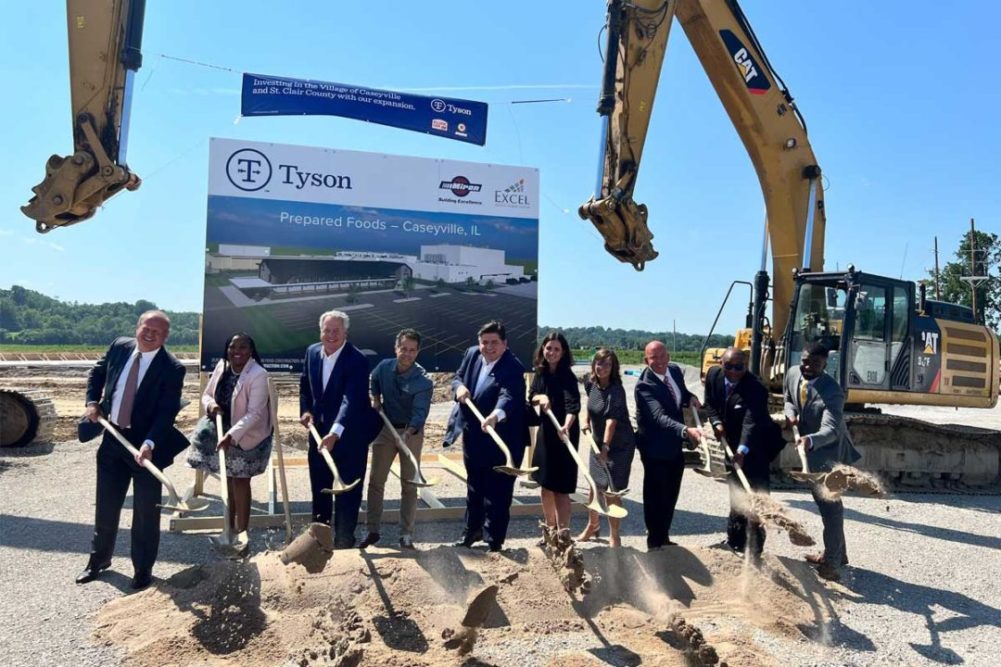 Tyson employees breaking ground on construction site