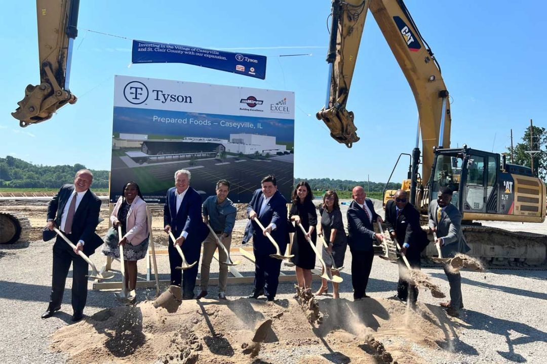 Tyson employees breaking ground on construction site