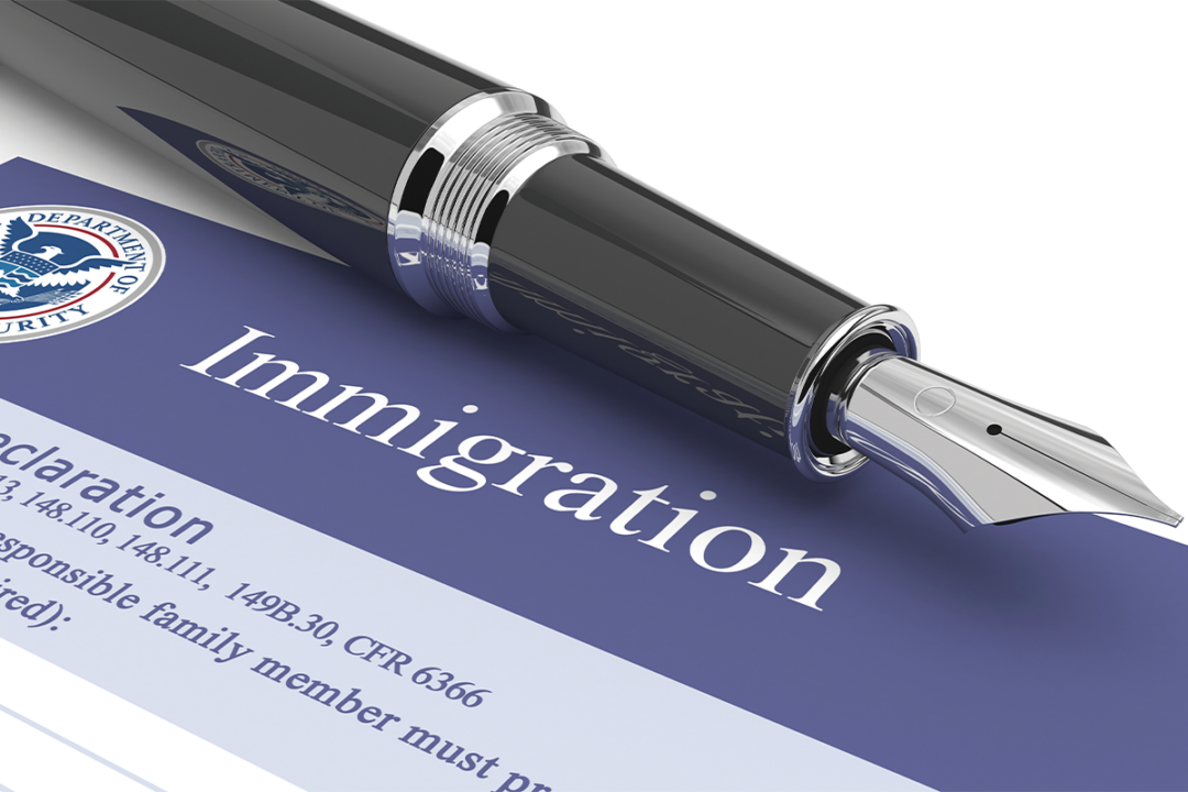 Pen and immigration papers