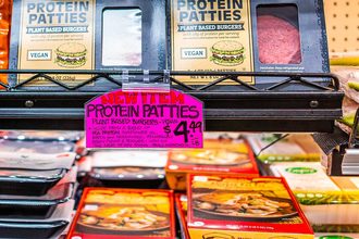 Plant-based patties in a grocery store case