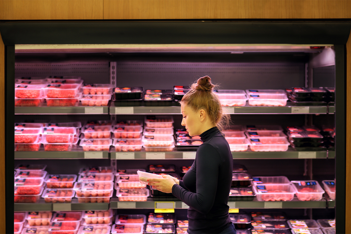 Shopper in meat aisle