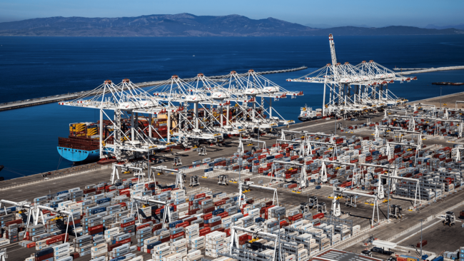 Image of cargo ships and shipping containers at the Med Tanger port.