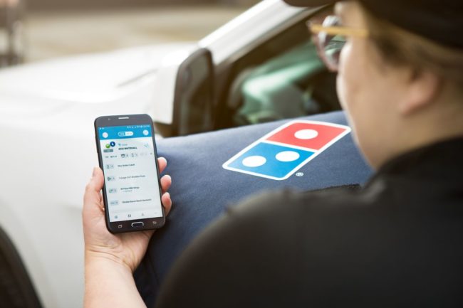 Domino's delivery driver using app