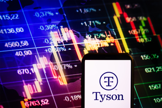 Smartphone displaying logo of Tyson Foods on stock exchange chart background