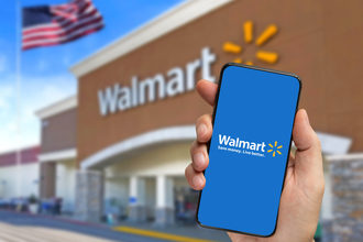 Walmart logo on a smart phone with store in background