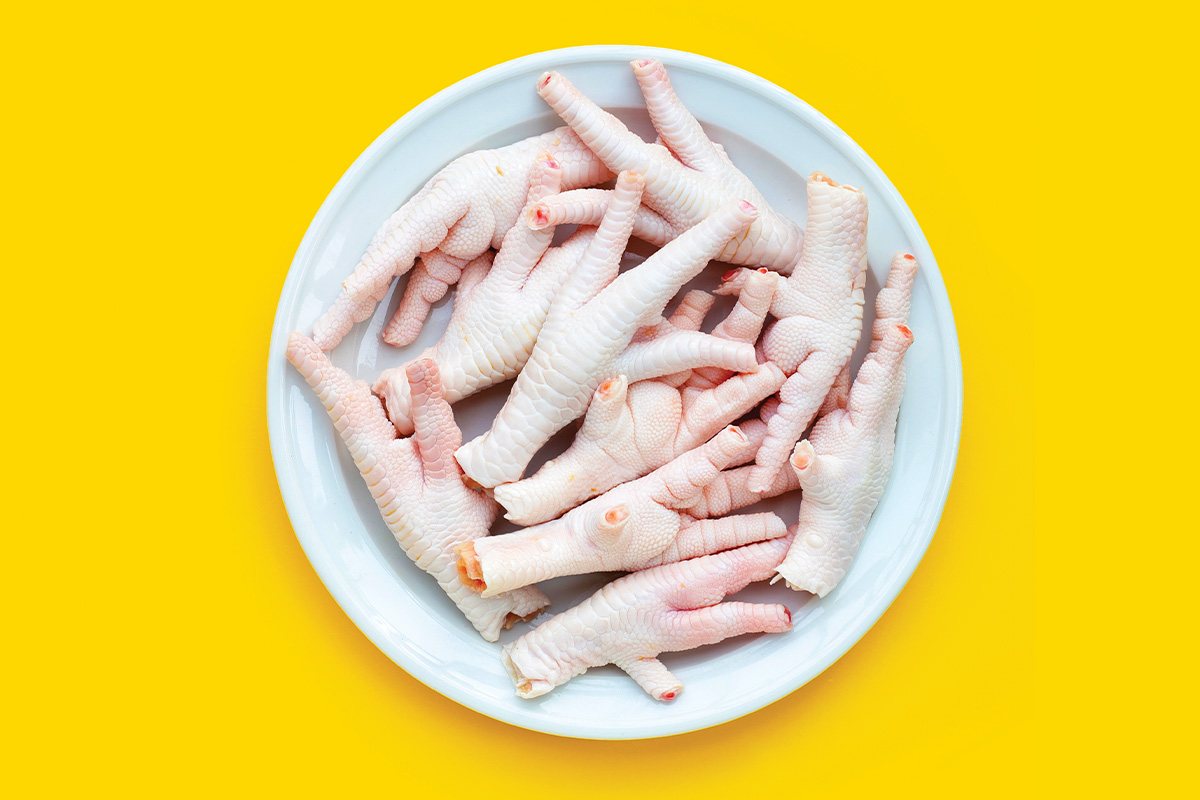 raw chicken paws on plate