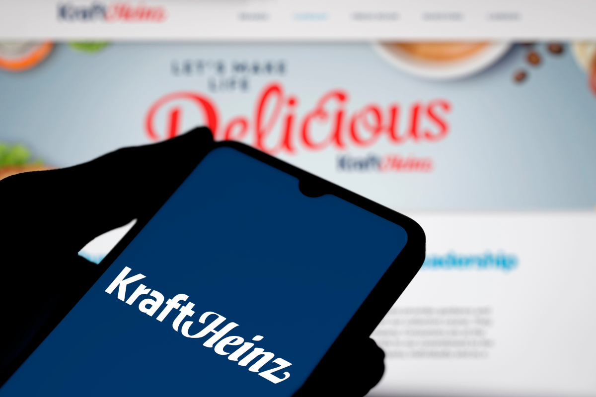 Kraft Heinz logo on phone screen with website in background