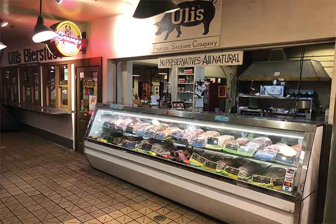 Uli’s Famous Sausage sells some of its popular German-style sausages at its counter at the well-known Pike Place Market in Seattle.