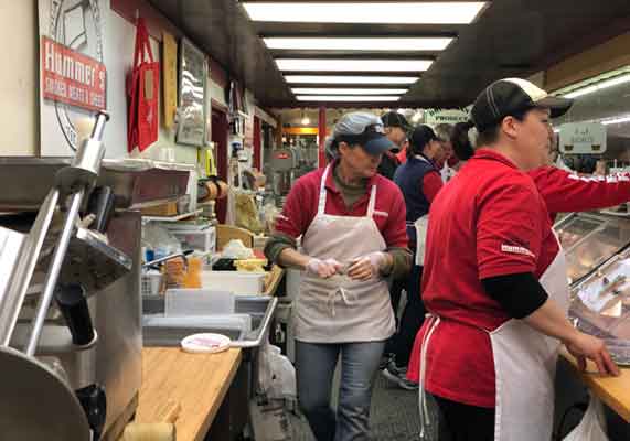 Family members work at the meat shop on a full-time and part-time basis.