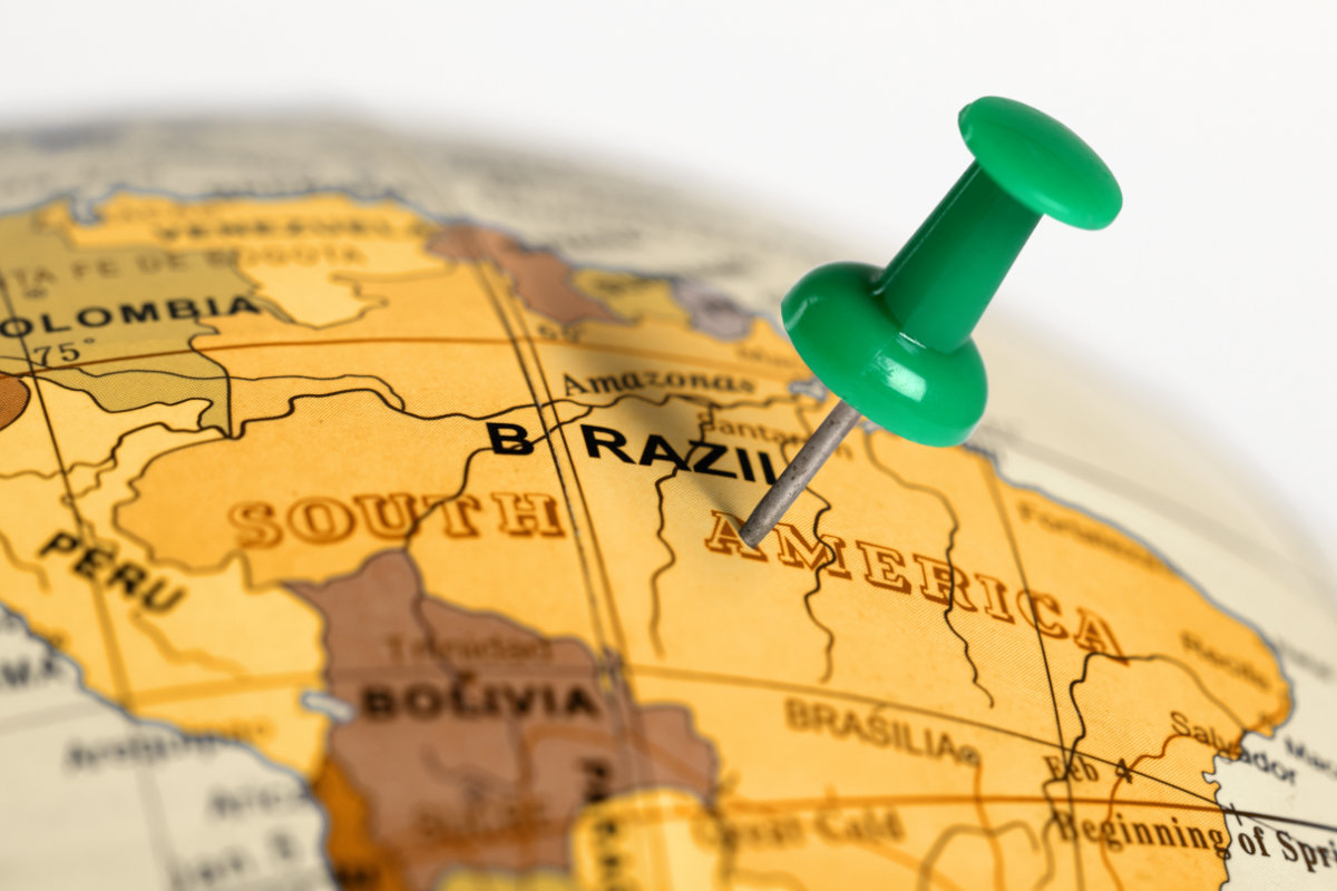 Country of Brazil marked by thumb tac on globe