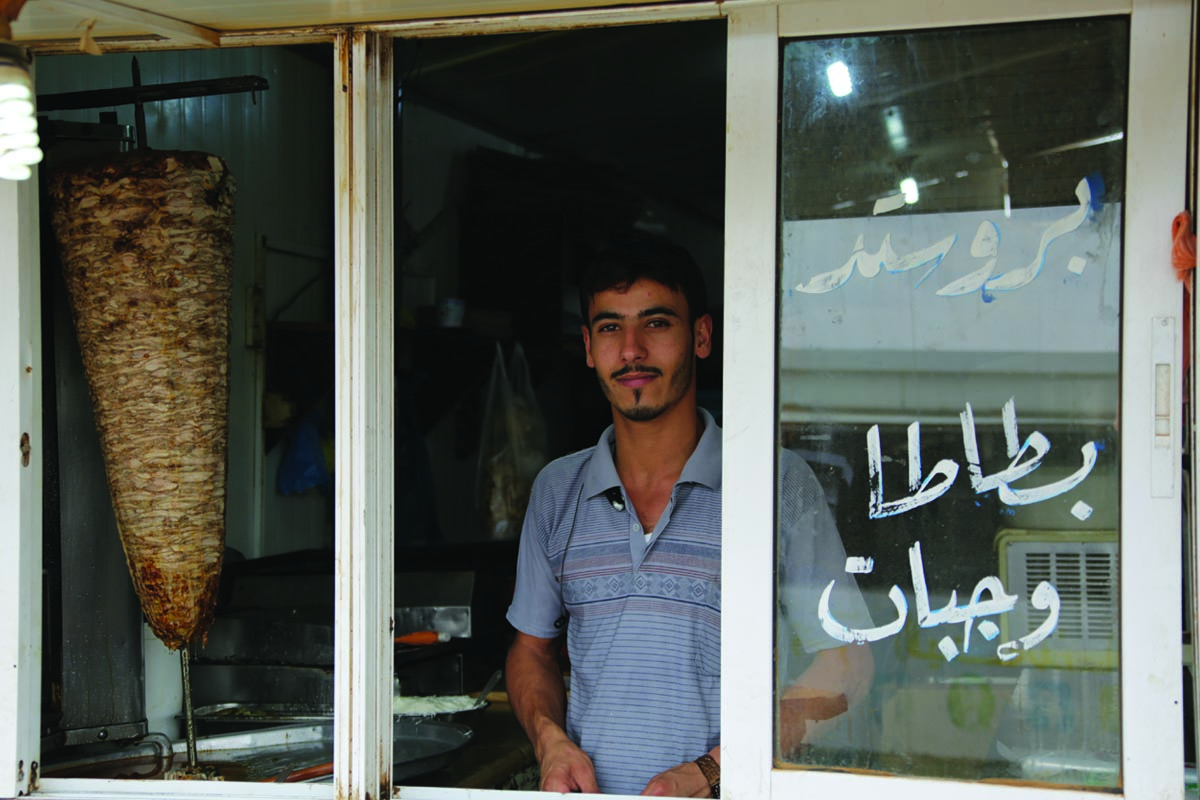 Syrian refugee Ahmed works as a shawarma chef in Za’atari Refugee Camp in Jordan.