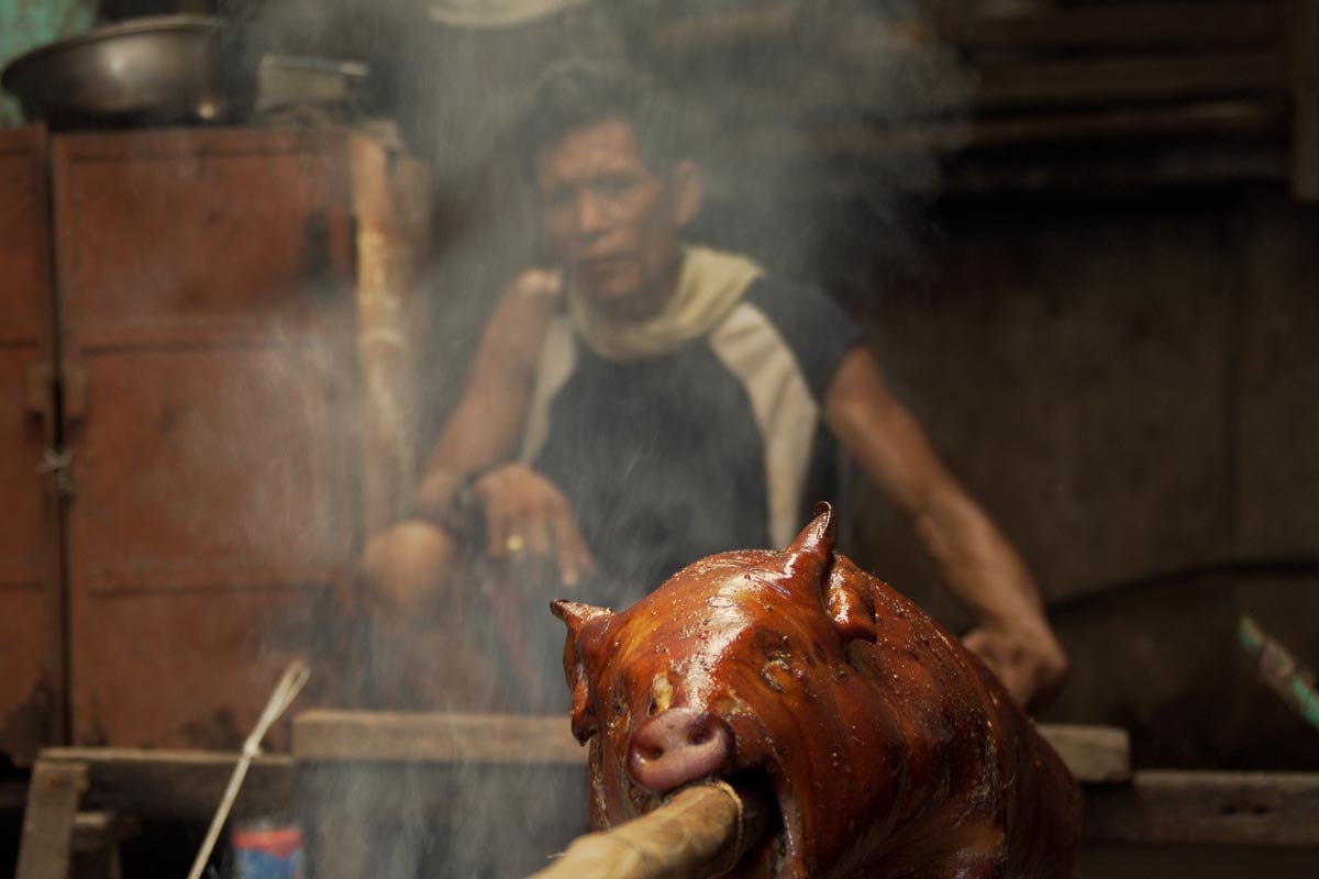 The filming during the visit to the Philippines captured the traditional cooking of lechon — whole pig cooked on a spit over an open flame.